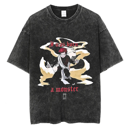 A black t-shirt with a distressed print of Gaara from Naruto. The image features Gaara in a battle pose, with the text "I was born a monster" written above him.