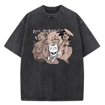 A black t-shirt with a distressed print featuring characters from the manga series "Dandadan." The image showcases Okarun, Momo Ayase, Ken Takakura, and Ayaka Saijo in a chaotic and humorous scene. The Japanese text on the shirt likely references characters or plot points from the series.