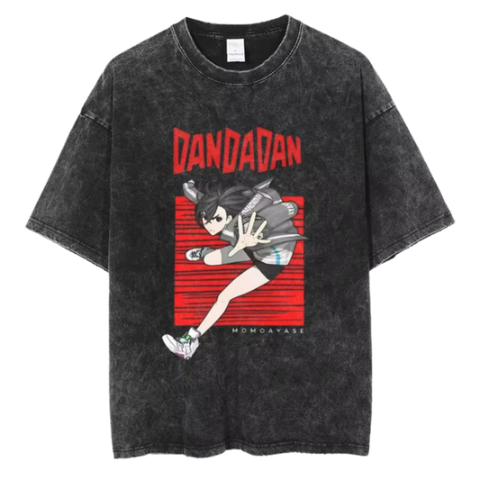 A black t-shirt with a distressed print of Okarun, a character from the manga series "Dandadan." He is depicted in a dynamic pose, with the word "DANDAN" written in red letters above him.