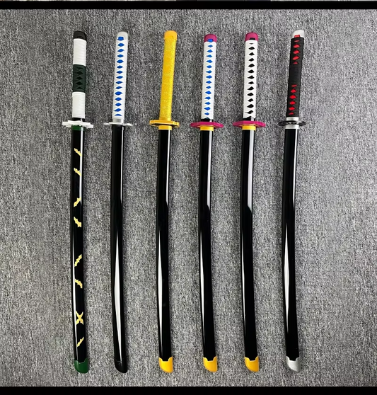 A collection of six Demon Slayer-style swords laid out in a row on a textured surface. The swords have black blades and various colored tsubas (handguards) and tsukas (handles). The tsubas are black, yellow, red, white, and two shades of green. The tsukas are black, yellow, red, white, and two shades of green. The swords have different patterns on the blades, including lightning bolts and diamonds.

Additional Notes:

The image appears to be a product photo, likely for a set of collectible swords.
The sword