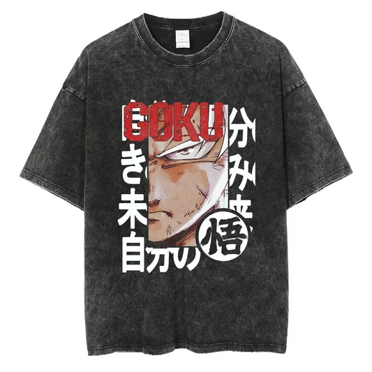  A black t-shirt with a distressed print of Goku in his Ultra Instinct form from the Dragon Ball series. The Japanese text on the shirt likely refers to Goku's transformation and power.