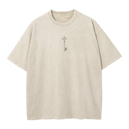 Front view of vintage sand acid wash tee featuring minimalist Attack on Titan basement key graphic.