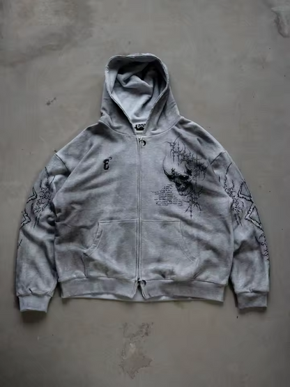 Front view of a heather grey heavyweight cotton zip-up hoodie featuring a gothic skull graphic and Berserk sleeve prints by SkaiiyPrints.