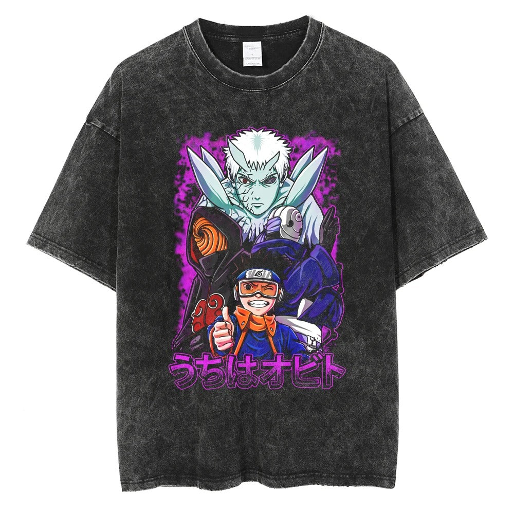 A black t-shirt with a distressed print of Obito Uchiha from Naruto. The image features Obito in his various forms, including his masked form and his Ten-Tails Jinchuriki form. The Japanese text "Uchiha Obito" is written at the bottom.