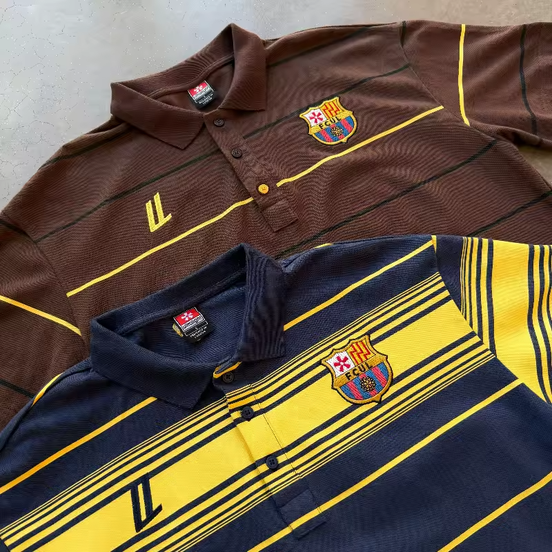Close-up view of the premium high-density embroidered FCUL crest and LL logo on the heavyweight textured polo fabric.