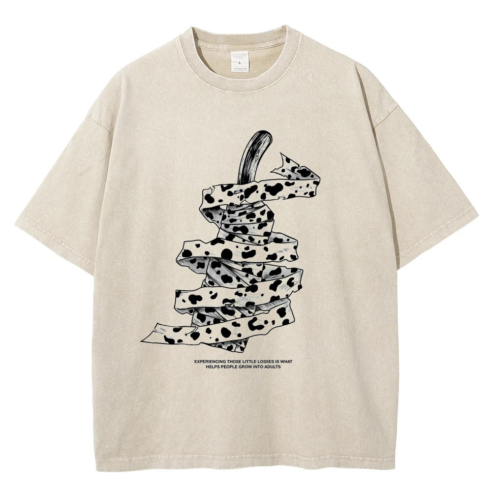 Front view of oversized 240 GSM vintage mocha brown acid wash streetwear tee featuring a detailed graphic of Kento Nanami's wrapped blunt sword and his iconic quote from Jujutsu Kaisen