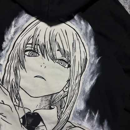 Detailed close-up of the Makima manga character graphic print on the back of a black streetwear hoodie.