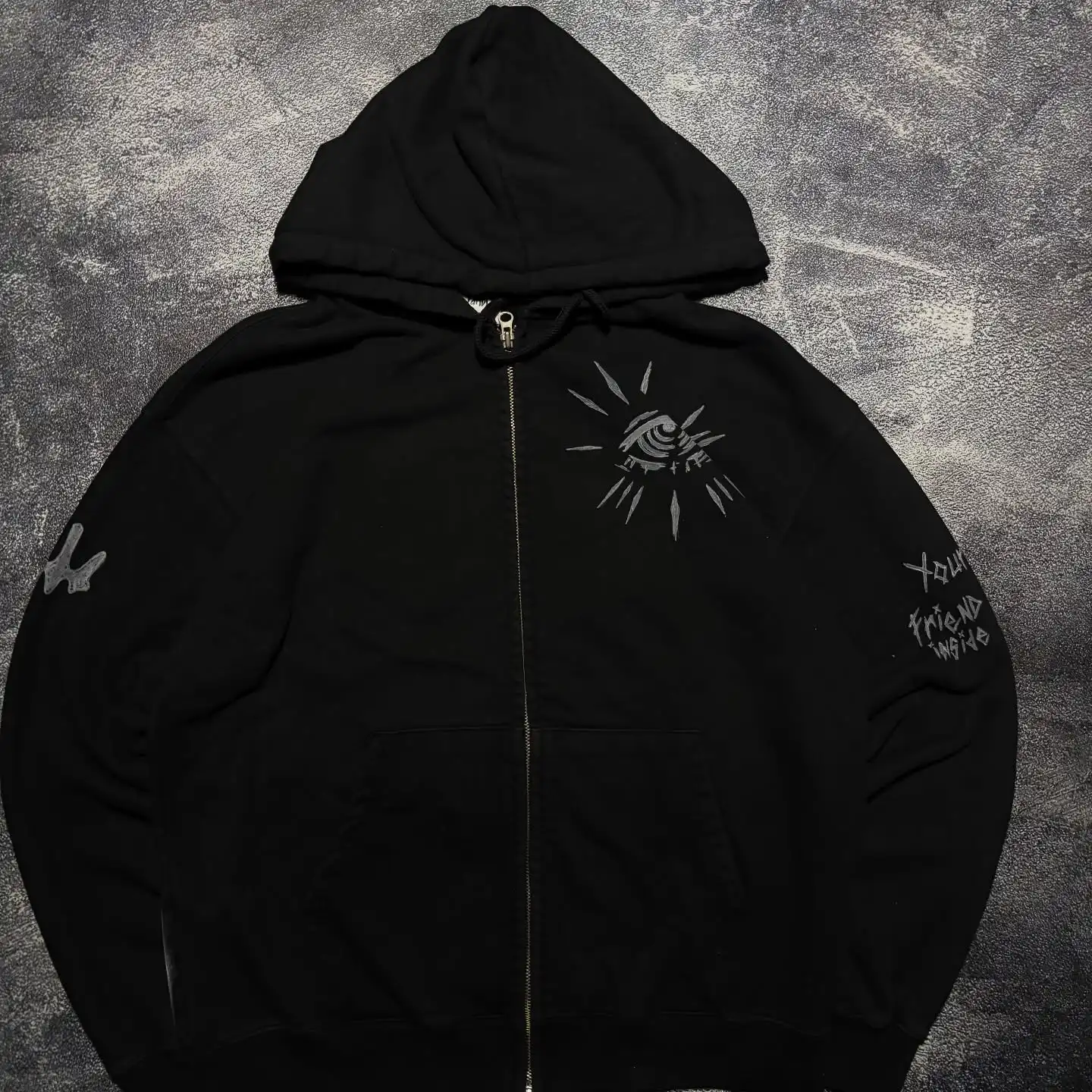 Black heavyweight cotton zip-up hoodie featuring high-density evil eye chest embroidery by SkaiiyPrints.