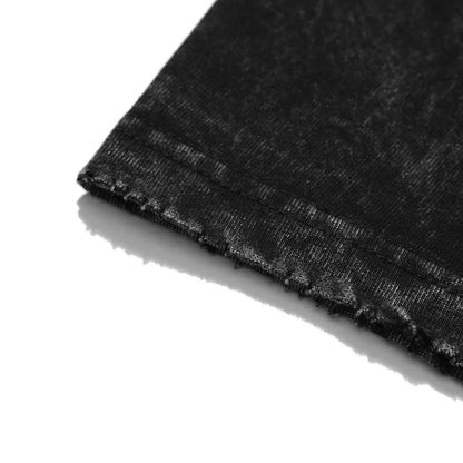 Macro close-up of the distressed and frayed sleeve hem detailing on a 240 GSM vintage black acid wash oversized t-shirt