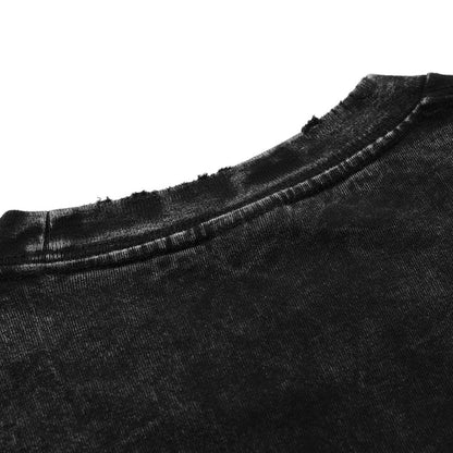 Detailed view of the frayed, distressed neckline and ribbed collar on a vintage black acid wash heavyweight tee.