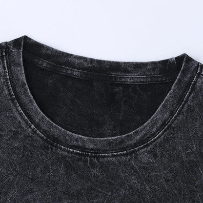 Close up front view of a thick ribbed crewneck collar on a blank vintage black acid wash streetwear t-shirt